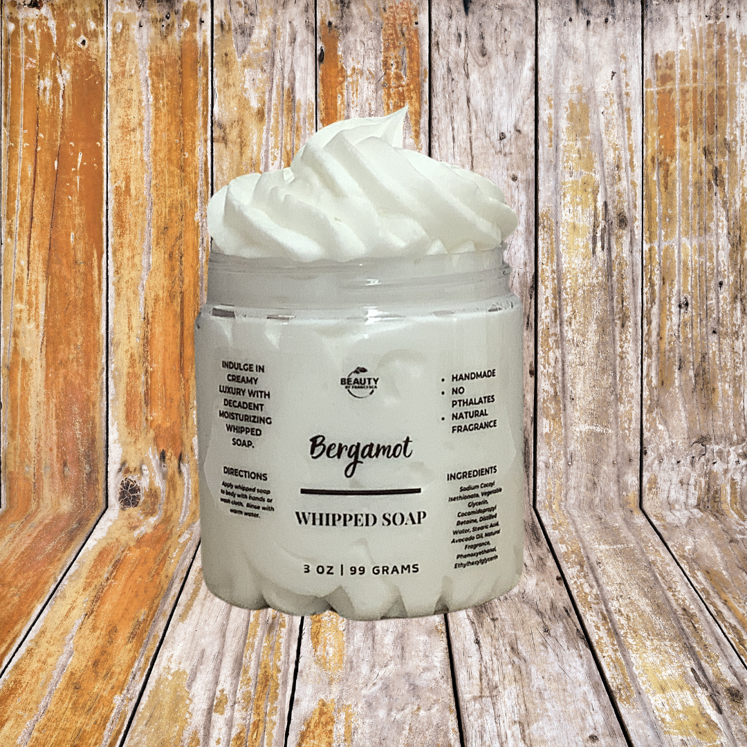 bergamot whipped soap with a wood background