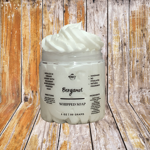 bergamot whipped soap with a wood background