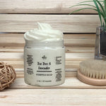 Tea Tree and Lavender Whipped Soap wood background next to brush
