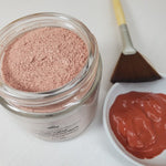 Anti-Aging Hydrating Face Mask next to fan brush and hydrated in small white dish