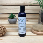 Blueberry Passion Body Wash wood background next to brush