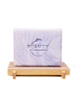 Marble-patterned lavender soap on a wooden stand with 'Beauty by Francesca' branding.