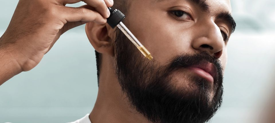 Man applying Beard Oil
