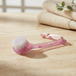 Pink facial cleansing brush