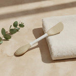 Silicone mask applicator showing the spatula and textured ends