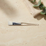 Facial mask brush with a clear acrylic handle