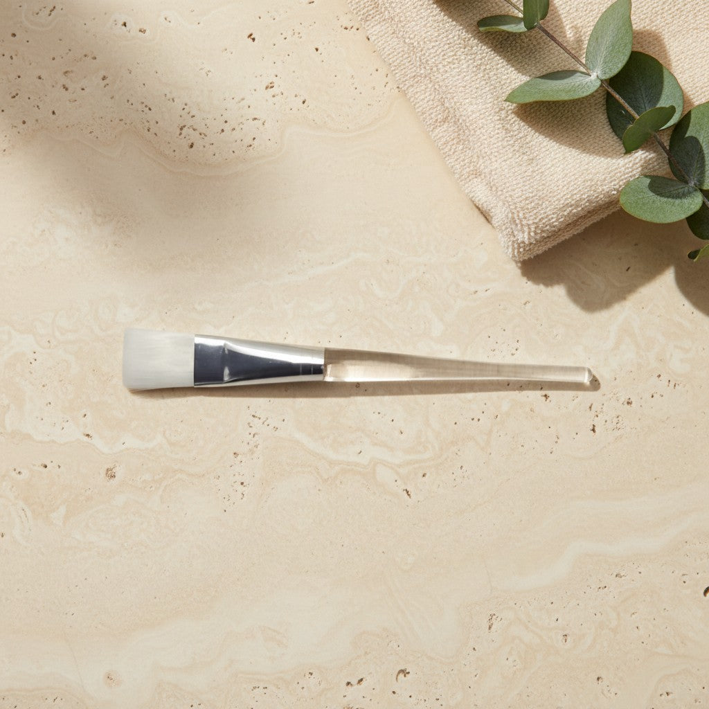 Facial mask brush with a clear acrylic handle