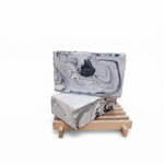 2 bars of Fire and Ice Soap on wood soap dish