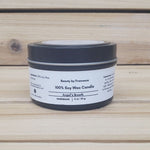 Angel's  Breath Candle in a black tin with lid closed against a wood background