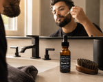 man applying Cardamom Beard Oil 