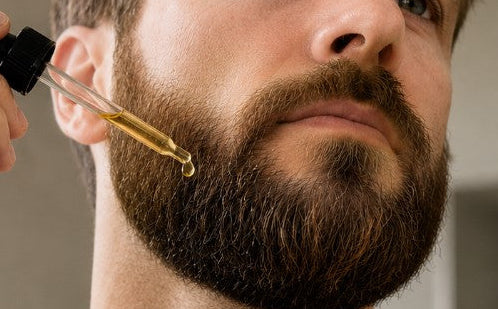 man applying all natural beard oil - ocean scent - 