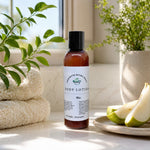 Bliss Body Lotion next to fresh pear slices and cream colored towel