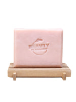 Pink geranium rose soap bar on a wooden stand with 'Beauty by Francesca' branding.