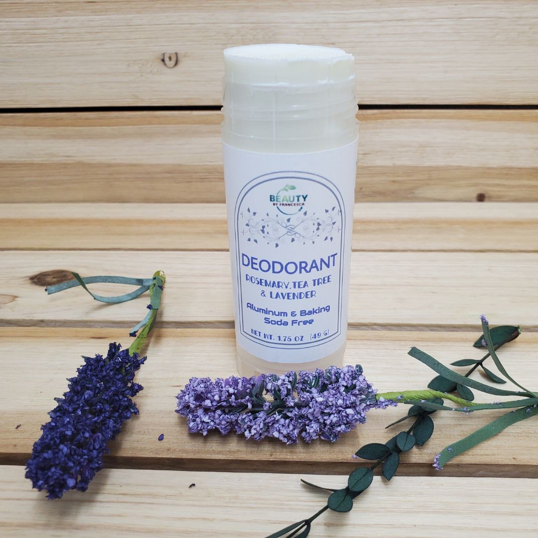 Handmade Natural Deodorant next to lavender and green herbs