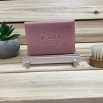 Harvest Apple Soap with wood background next to plant and  skin brush