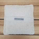 Soaping Sponge Pocket against a wood background