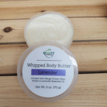 Lavender whipped body butter open container with lid positioned on the side