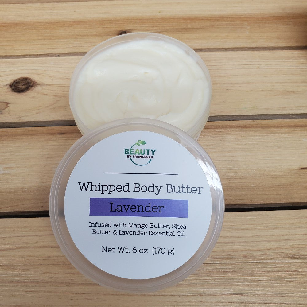 Lavender whipped body butter open container with lid positioned on the side