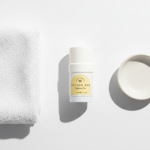 Fragrance Free Lotion bar  next to a towel and white soap dish
