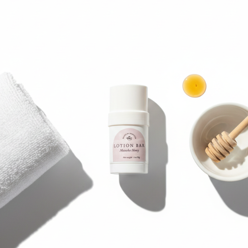 Manuka Honey Lotion bar with a towel and honey dipper on a white background