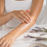 Woman applying Lavender Body Lotion to forearm
