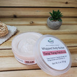 Ylang Ylang Patchouli  Whipped Body Butter Open Lid Next to Plant