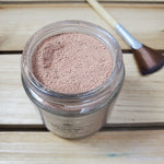 chocolate bliss face mask  next to fan brush