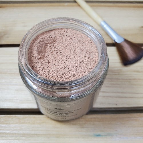 chocolate bliss face mask  next to fan brush
