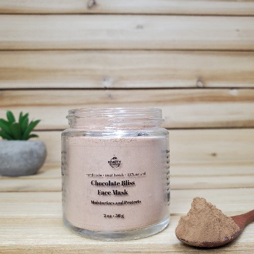 chocolate bliss face mask  next to wooden spoon 