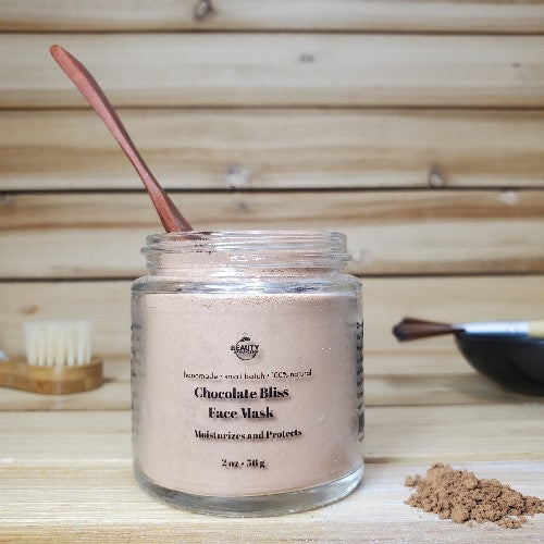 chocolate bliss face mask  with wooden spoon in container