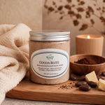 Cocoa Blitz  Chocolate Body Scrub  surrounded by candle, cocoa beans, and cocoa butter