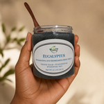 hand holding eucalyptus body scrub