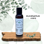 Eucalyptus Mint Body Wash  on wood pedestal