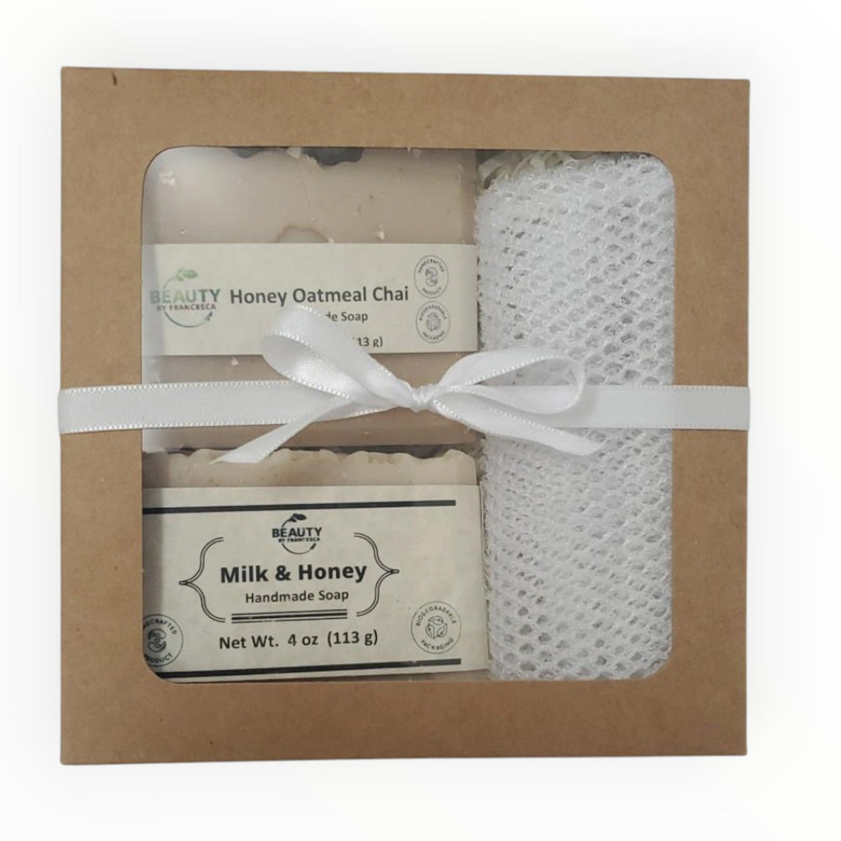 Everyday Self-Care Gift Box with Honey Oatmeal Chai and Milk & Honey soaps and a white bubble maker soap net in a kraft gift box