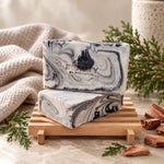 Two bars of Fire and Ice handmade soap on a wooden soap dish with cedarwood accents