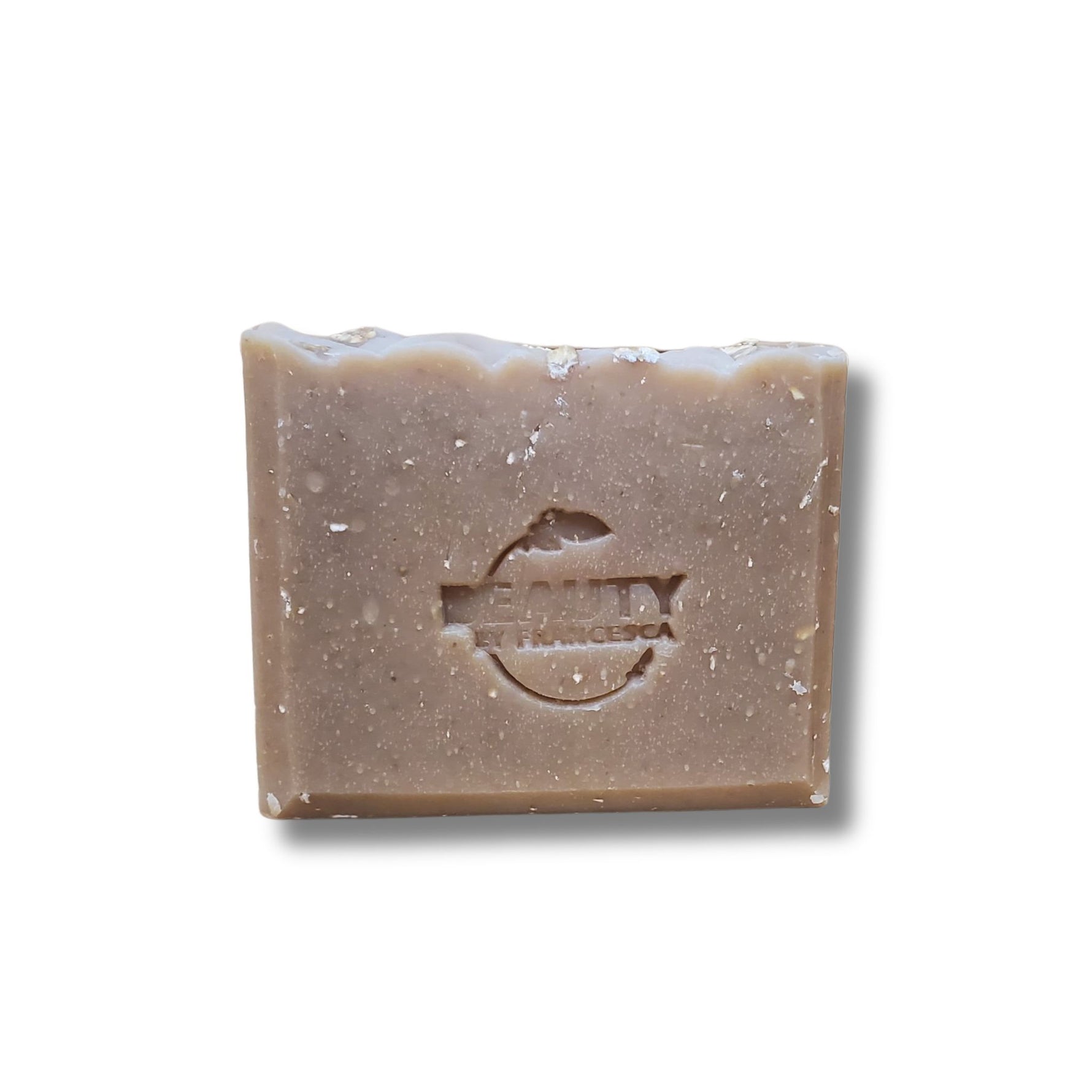 Bar of honey oatmeal chai soap with a logo on a white background