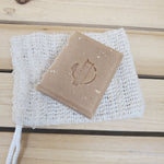 bar of honey oatmeal chai soap on a mesh sisal