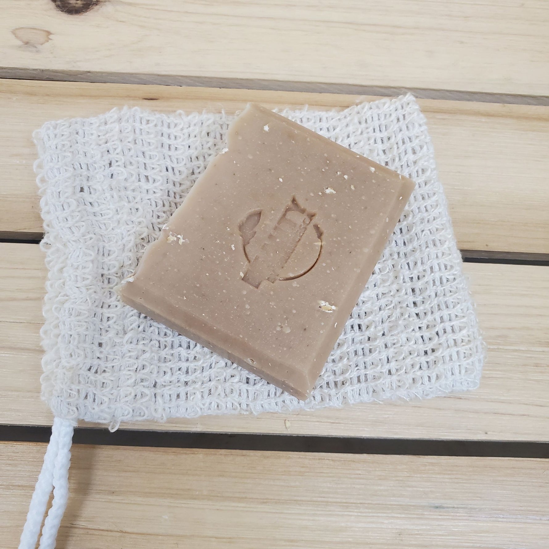 bar of honey oatmeal chai soap on a mesh sisal