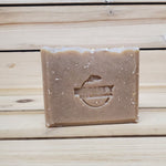 bar of honey oatmeal chai soap against a wood background