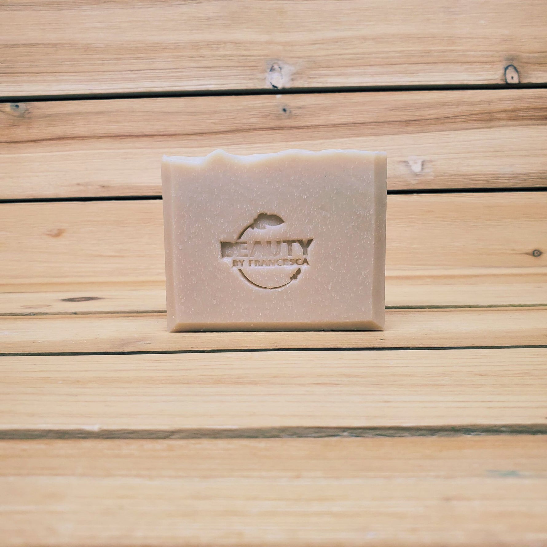 lavender orange bar soap on a wood background