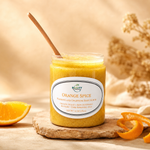orange spice body scrub with orange slice and orange peels