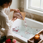 woman pouring royal rose bath salt, 16 oz, into bath tub