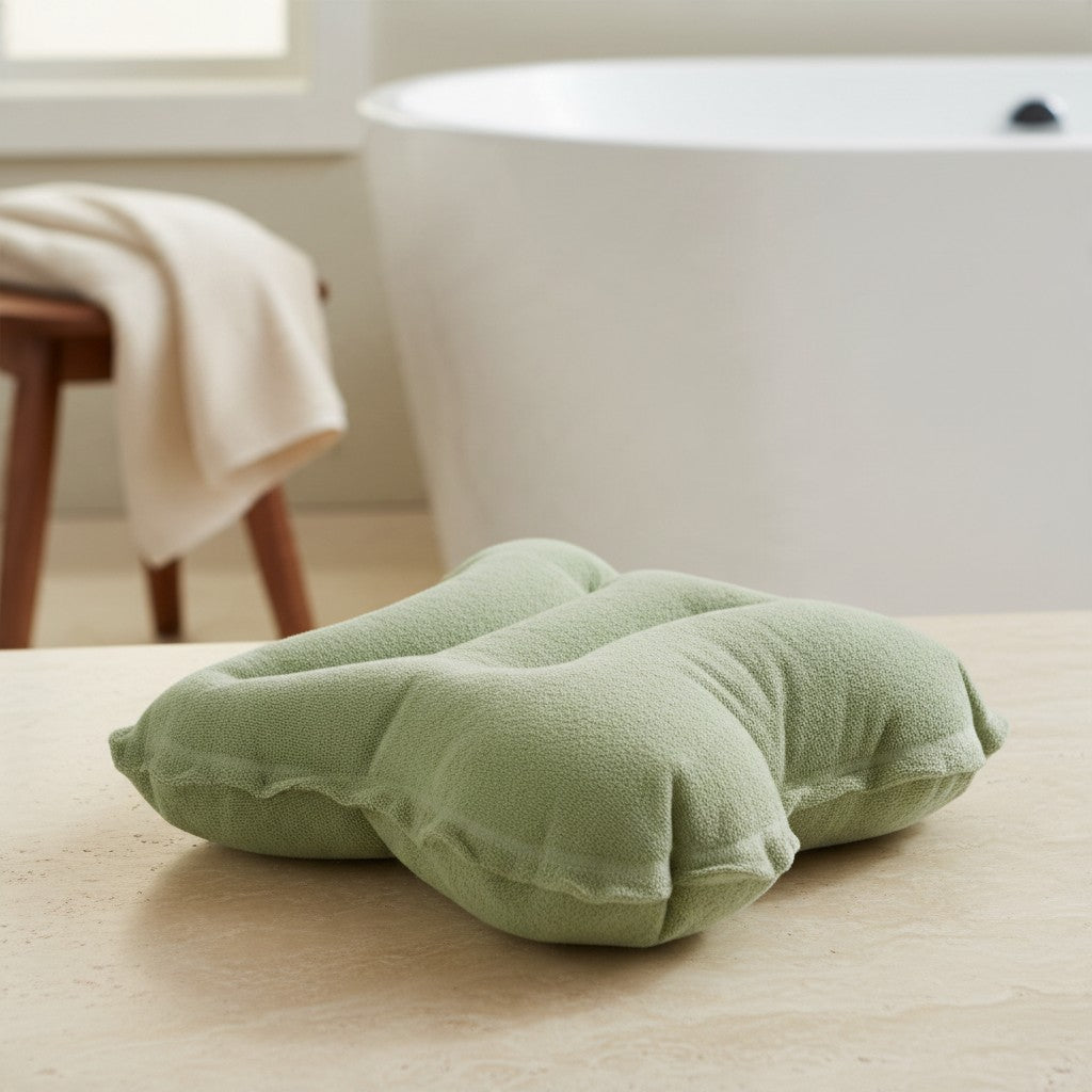 Terry bath pillow angled view showing its shape