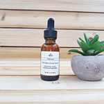 renew facial serum next to plant