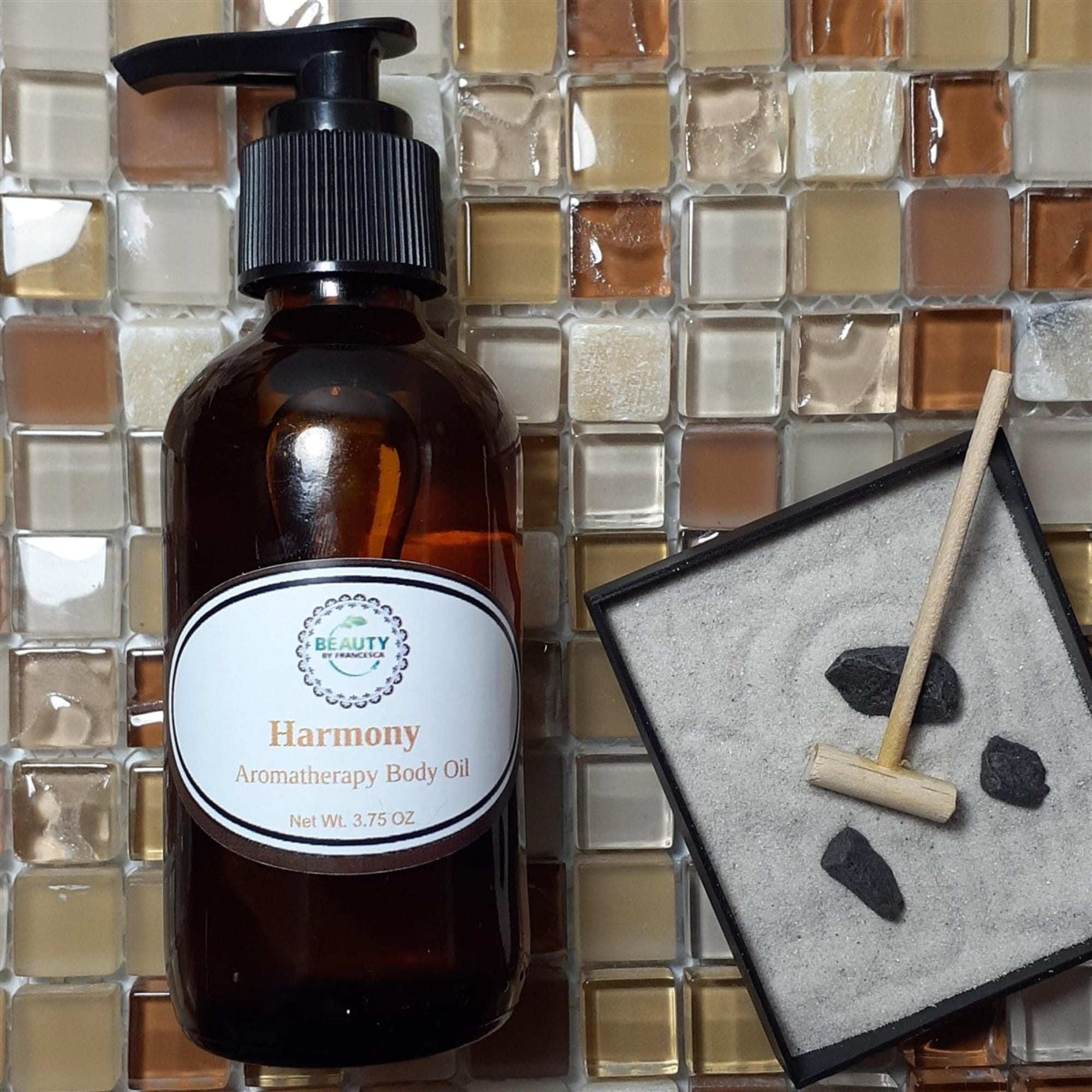 Harmony Aromatherapy Body Oil styled with rock sandbox