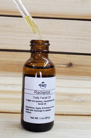 radiance facial oil open with oil dropper
