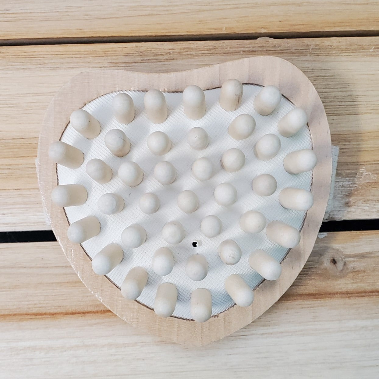 wood peg heart massager