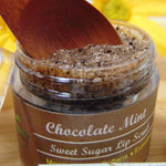 chocolate mint  lip scrub displayed with wooden spoon