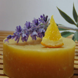 Lavender Orange Coconut Milk Soap dispplayed with lavender and orange