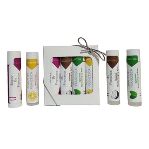lip balm set displayed with berry, orange, spearmint and coconut lip balms